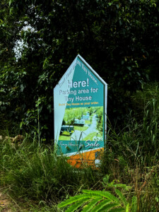 Baht, Bucks, and Butterfly Wings.. 2 tiny house KS sign