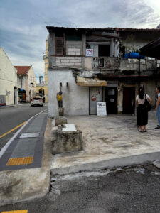 living like im dying boy on chair mural unesco george town